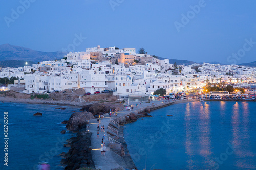 Hora (Old Town) with Causeway to the Temple of Apollo in the foreground, Naxos Island, Cyclades Group, Greek Islands, Greece photo