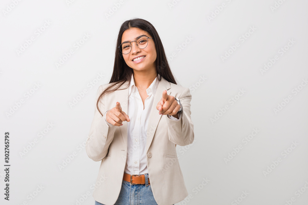Young business arab woman isolated against a white background cheerful smiles pointing to front. Young business arab woman isolated against a white background cheerful smiles pointing to front.