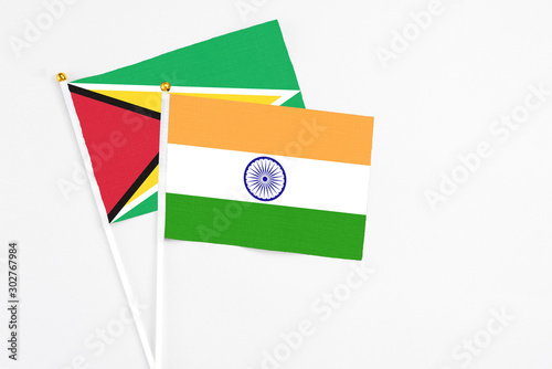 Free Download India and Guyana stick flags on white background. High quality fabric, miniature national flag. Peaceful global concept.White floor for copy space. - GFXLoad