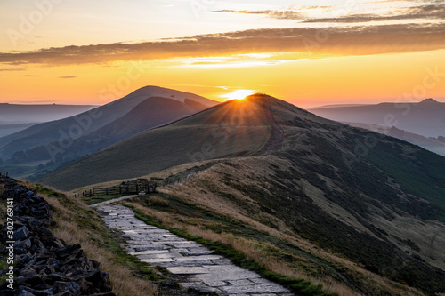 The sun rising above Lose Hill and Back Tor, The Peak District National Park, Derbyshire