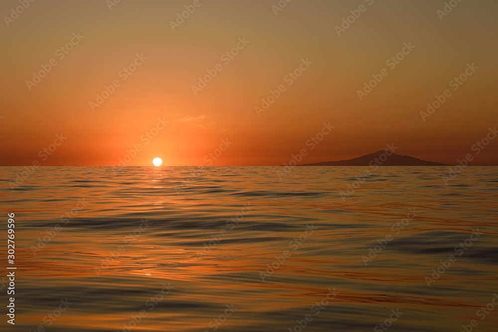 EVENING SUNSET IN THE SEA