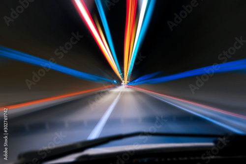 Speeding in a tunnel from view of a drivers angle.