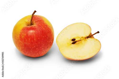 Whole apple and a half on white background, isolated, closeup