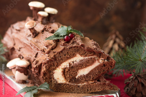 Canvas-taulu Chocolate yule log christmas cake on wooden background.