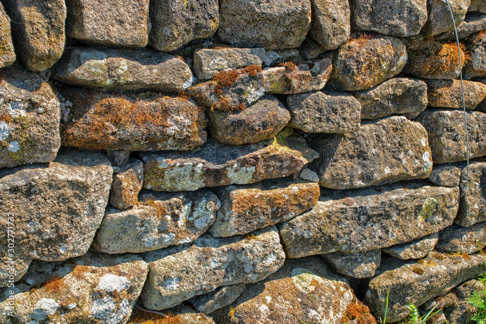 Stone wall. Abstract dry stones in boundary wall in Derbyshire Peak District countryside. Stone material construction, natural and textured. Stone wall. Abstract dry stones in boundary wall in Derbyshire Peak District countryside. Stone material construction, natural and textured.