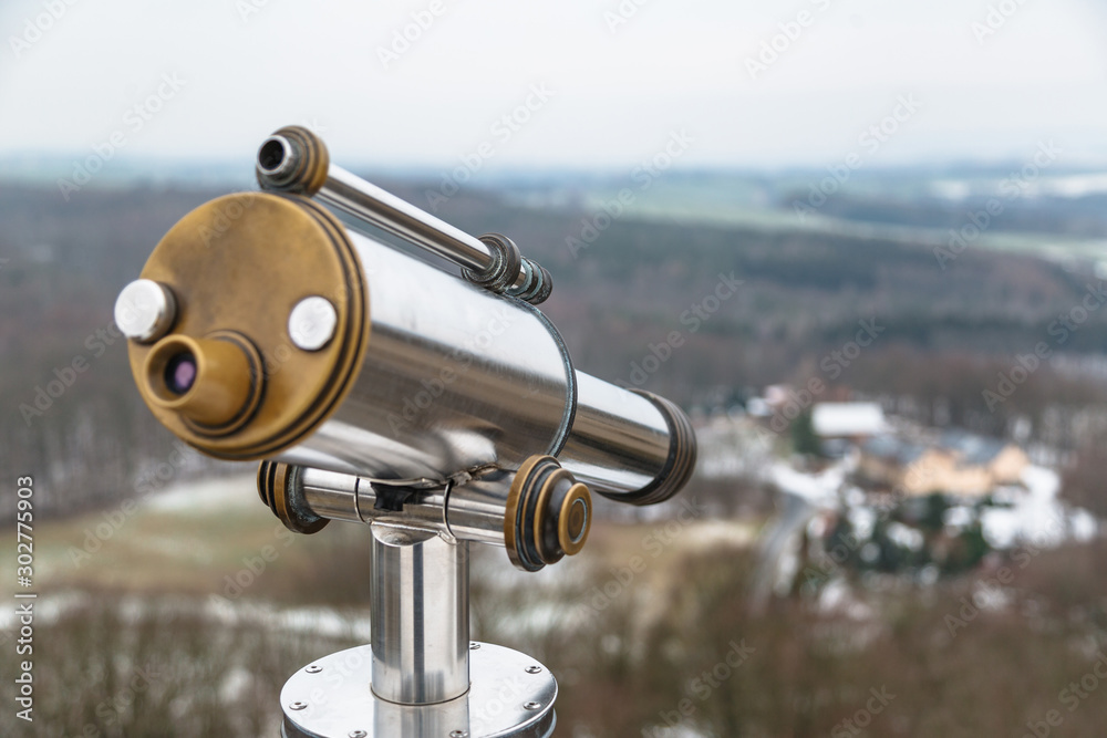 Binocular on observation deck on hill in winter