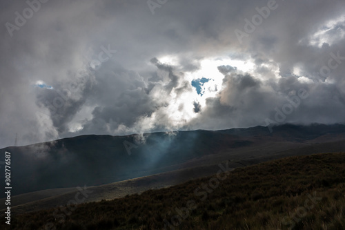 Sun behind dark clouds