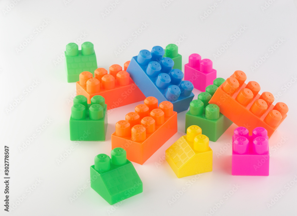 bricks of the children's designer of different sizes and different colors on a white background bricks of the children's designer of different sizes and different colors on a white background