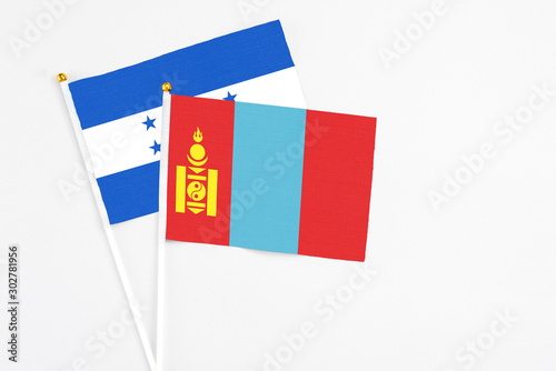Free Download Mongolia and Honduras stick flags on white background. High quality fabric, miniature national flag. Peaceful global concept.White floor for copy space. - GFXLoad