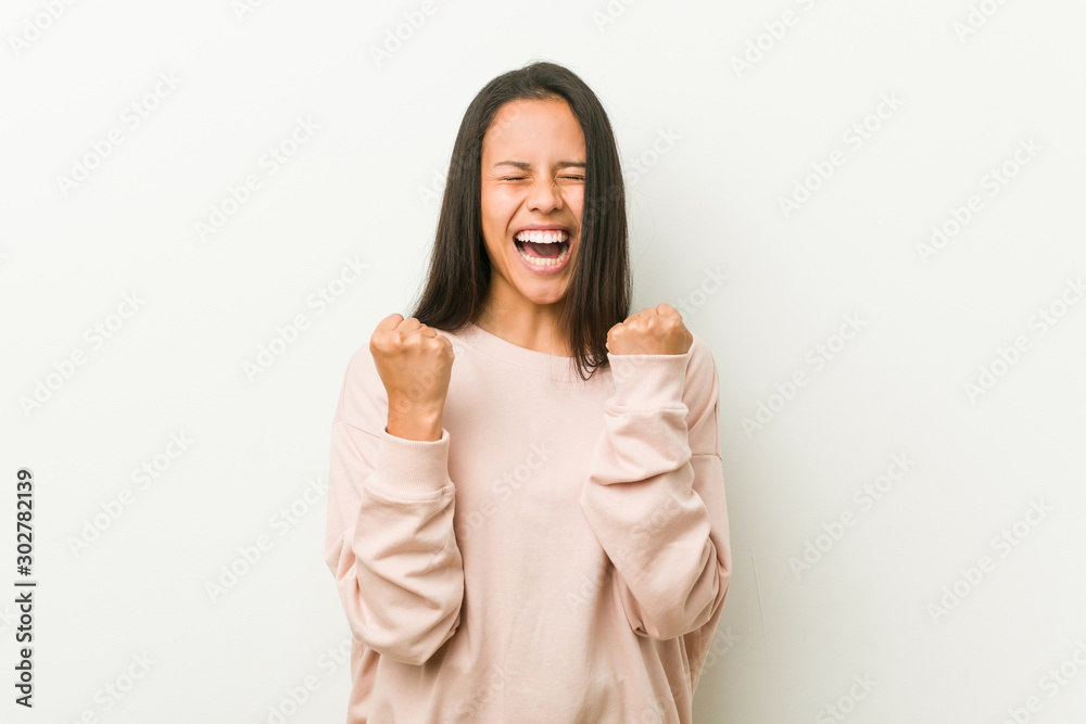 Young cute hispanic teenager woman cheering carefree and excited. Victory concept. Young cute hispanic teenager woman cheering carefree and excited. Victory concept.