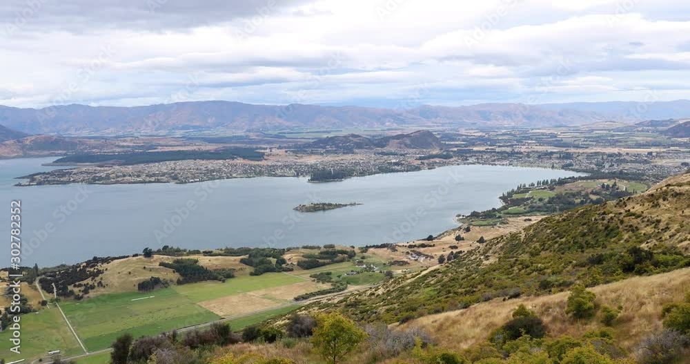 New Zealand Mountain lake nature landscape on New Zealand on famous Wanaka hike to Roys Peak. Amazing nature on New Zealand. 59.94 FPS SLOW MOTION. New Zealand Mountain lake nature landscape on New Zealand on famous Wanaka hike to Roys Peak. Amazing nature on New Zealand. 59.94 FPS SLOW MOTION.