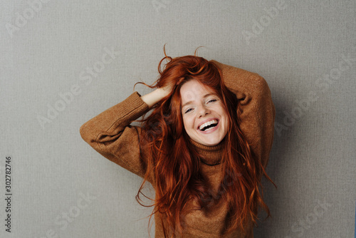 Fotografija Happy lively young woman laughing at the camera
