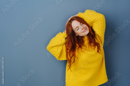 Canvas Print Blissful young woman enjoying a quiet moment