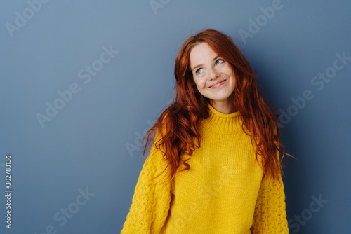 Simpering young woman with a coy smile