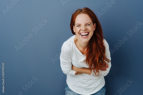 Happy vivacious young woman with sense of humour