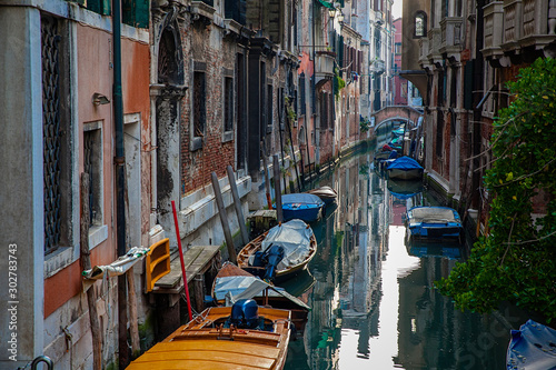 Venice canal with boats and old architecture