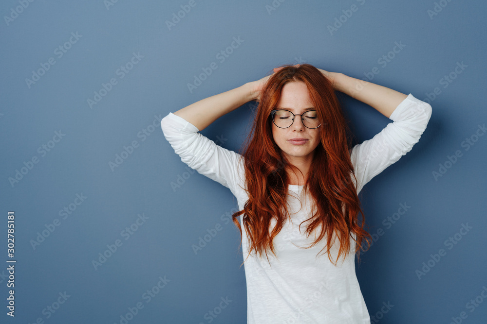 Serene serious young woman enjoying a moment Serene serious young woman enjoying a moment