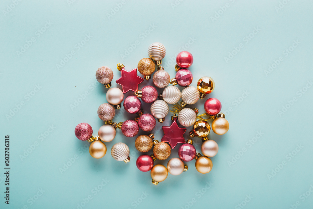 A lot of Christmas balls of pink and gold color. A lot of Christmas balls of pink and gold color.