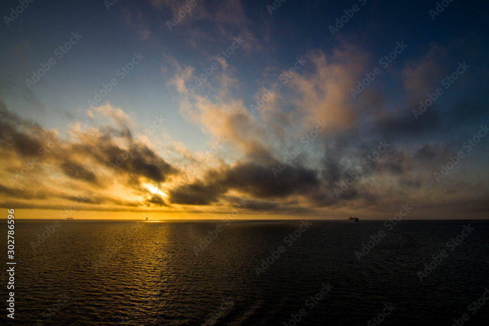 Sunset with cruise ships on the horizon