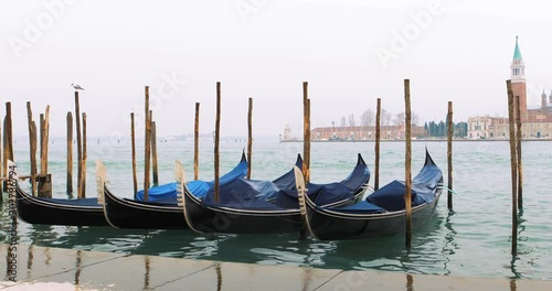 Traditional Venice Gondolas on Grande Canal with view of San Giorgio Maggiore church. View from Piazza San Marco. Venice Italy. Shot filmed in 4k 2160p