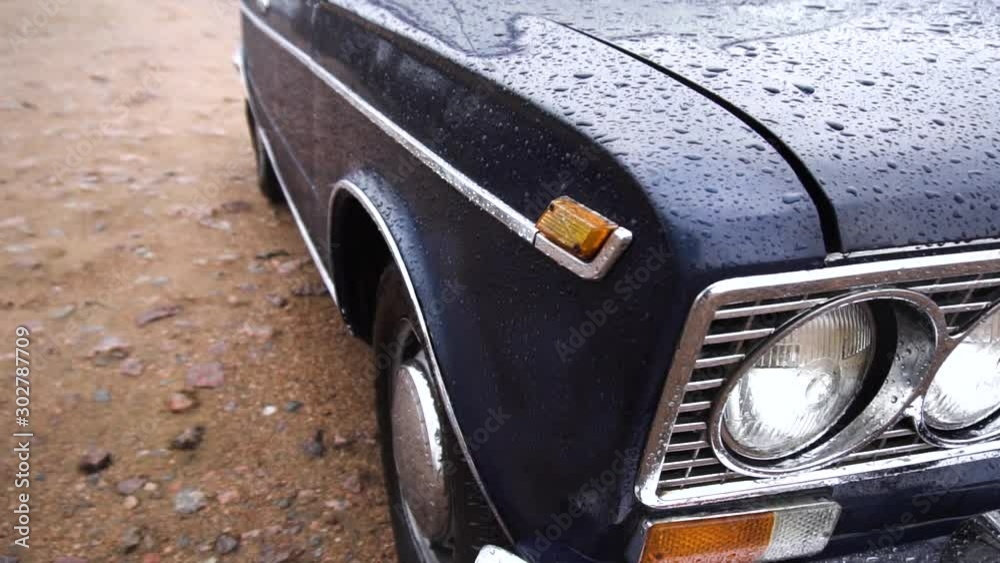 Close up footage of headlight of blue old retro car.