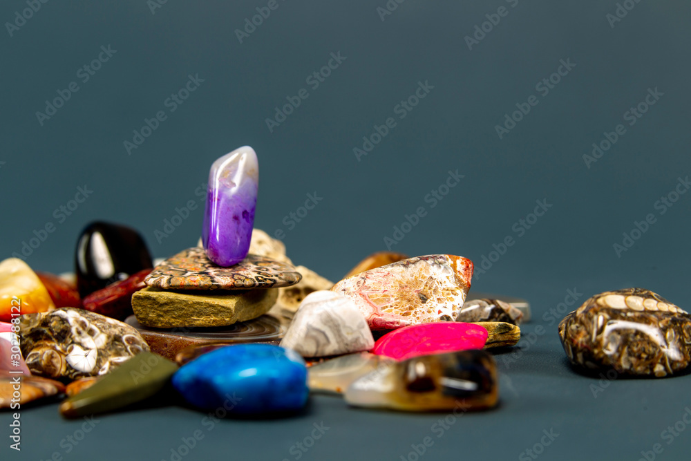 Polished rocks on a dark grey background Polished rocks on a dark grey background