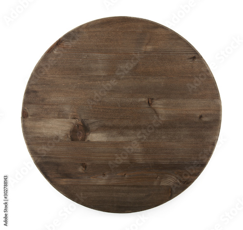 Dark round wooden Board isolated on white background. View from above.