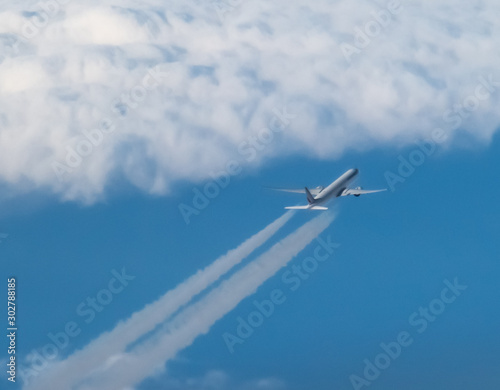 aerial view of airliners with contrails 