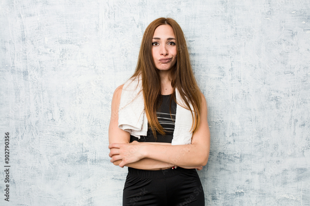 Εκτύπωση καμβά Young fitness woman unhappy looking in camera with sarcastic expression