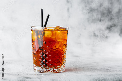 Glasse of iced black tea with lemon, overhead view. isolated on bright marble background. Overhead view, copy space. Advertising for cafe menu. Coffee shop menu. Horizontal photo.