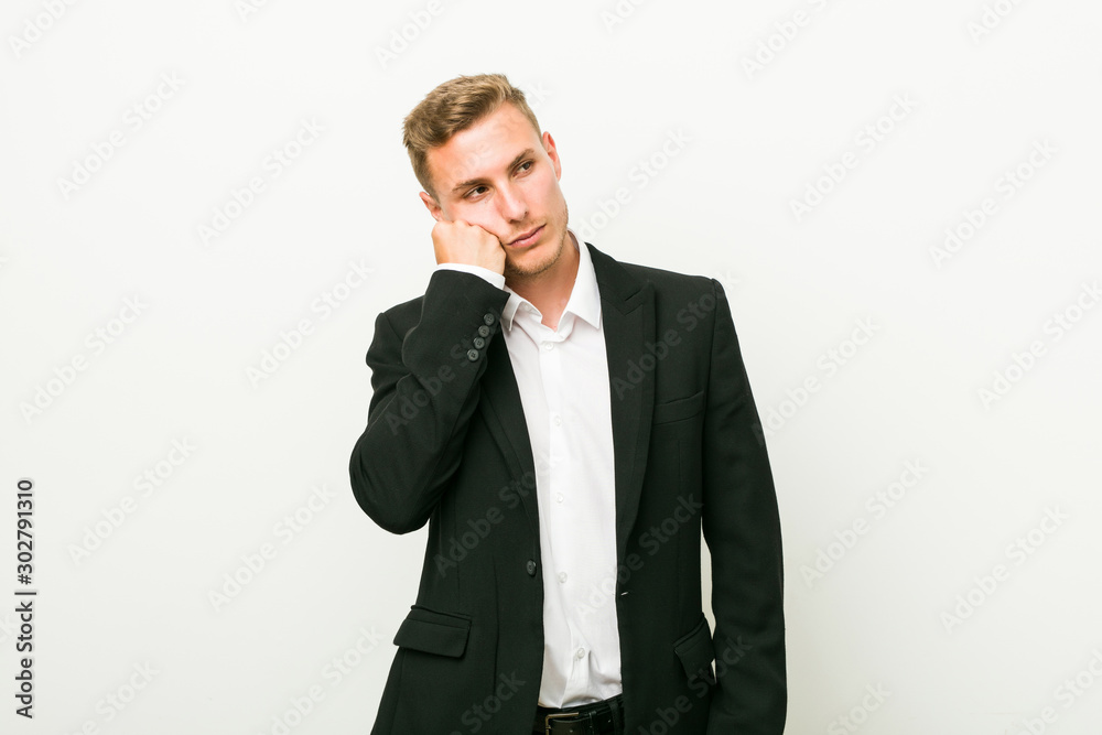 Young caucasian business man who feels sad and pensive, looking at copy space. Young caucasian business man who feels sad and pensive, looking at copy space.