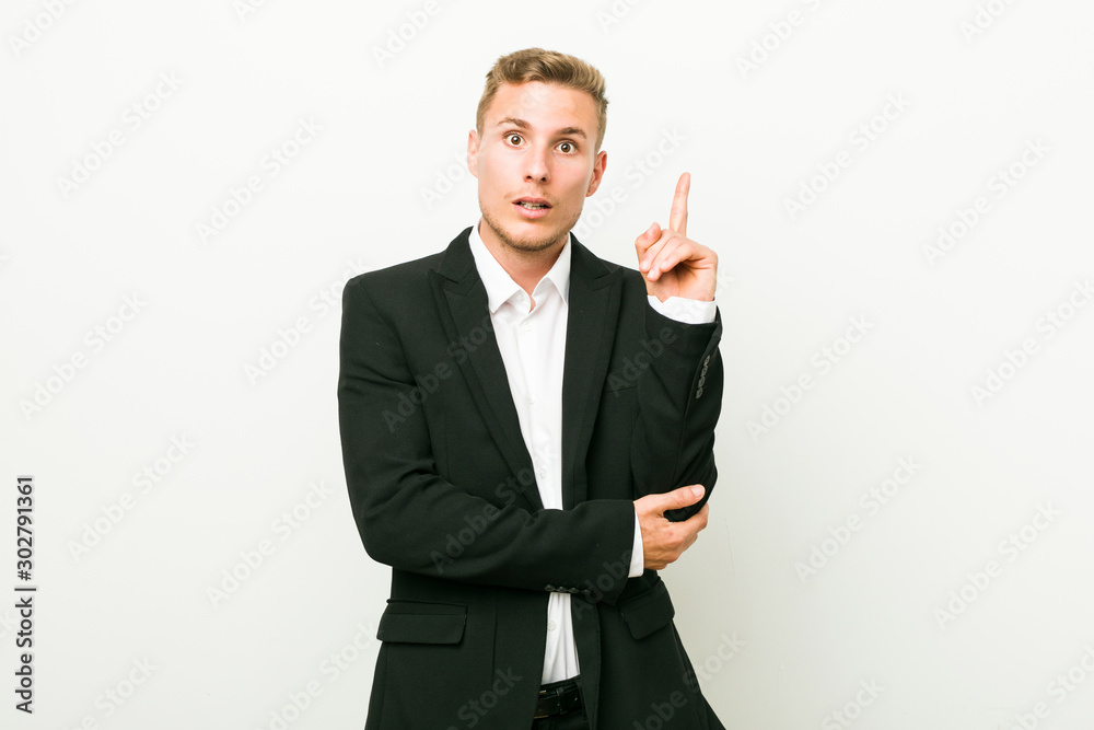 Young caucasian business man having some great idea, concept of creativity. Young caucasian business man having some great idea, concept of creativity.