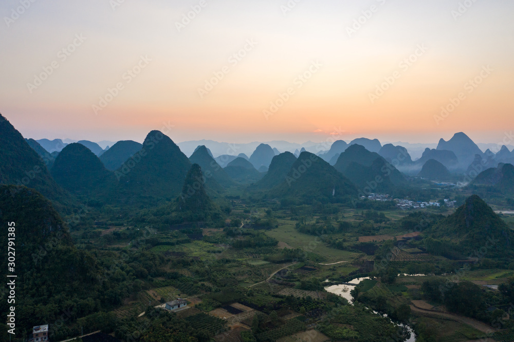 Drone Sunset View of Guilin, Li River and Karst mountains, Guilin city, Guangxi, province, China