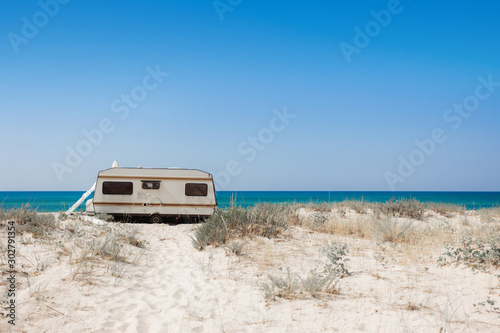 One trailer on the beach. Freedom concept  travel life. Sea landscape background with copy space. Kherson  Ukraine. 