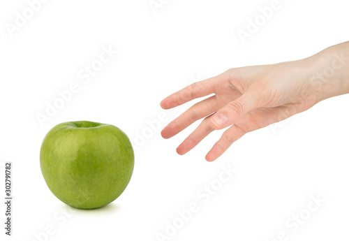  Woman's hand reaches for an green apple on a white background