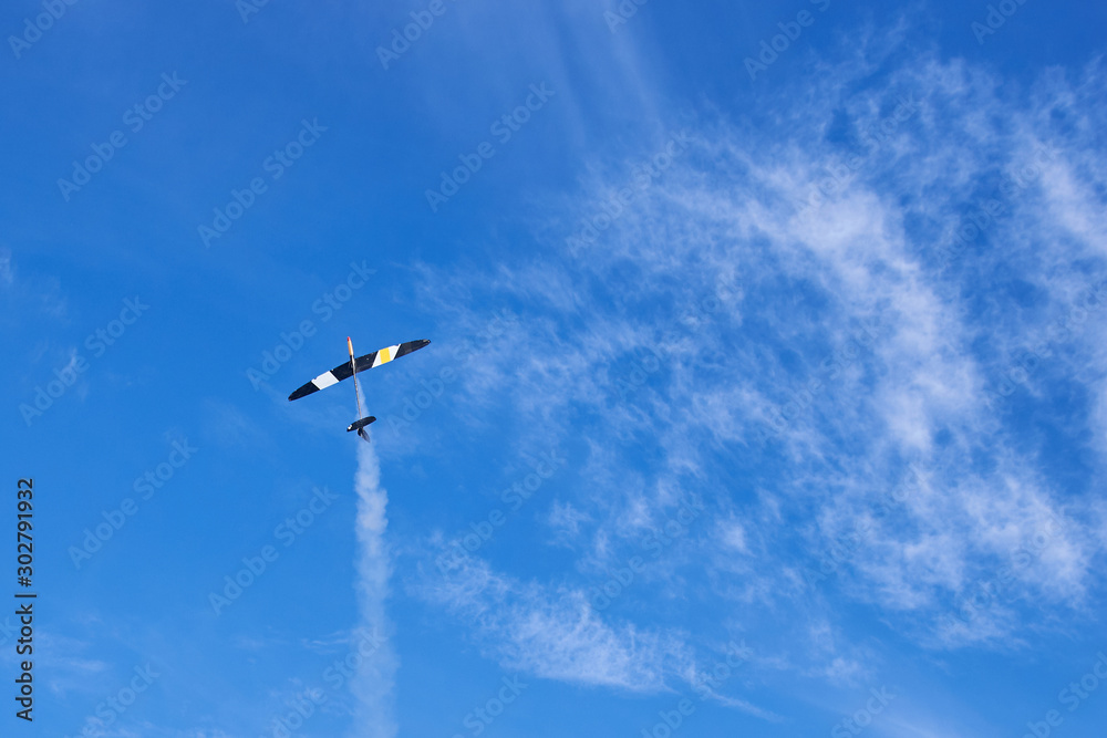 Fototapeta premium A model of a radio-controlled rocket plane soaring into the sky.