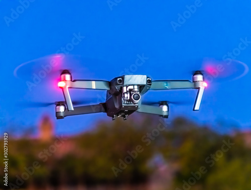 A close up of a drone hovering