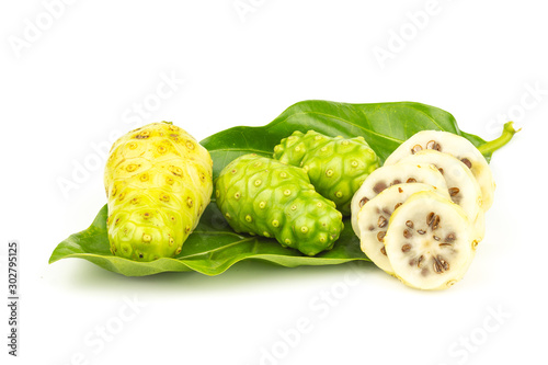 Noni fruit with green leaf on white background.