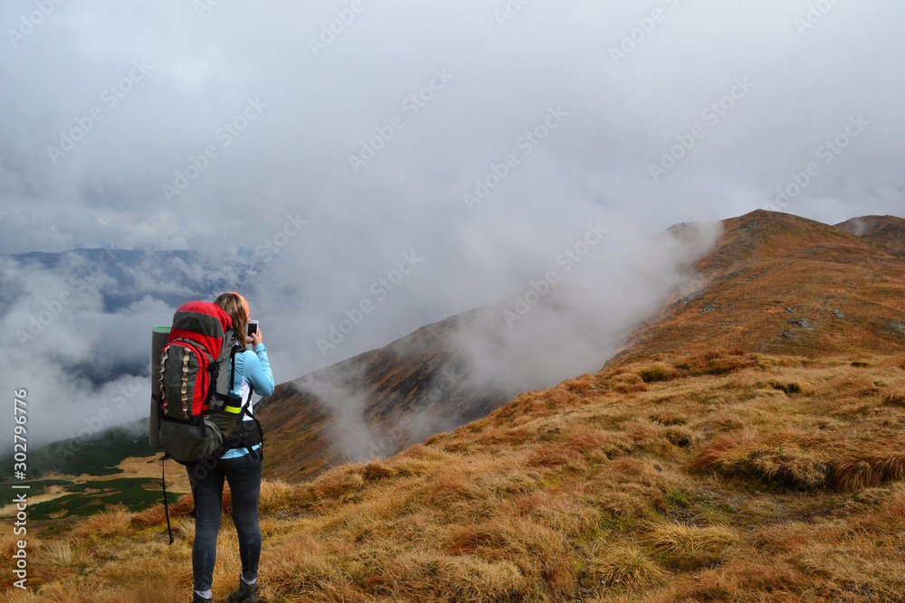 Girl on autumn mountains.  Ukrainian Carpathian Mountains