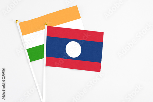 Free Download Laos and India stick flags on white background. High quality fabric, miniature national flag. Peaceful global concept.White floor for copy space. - GFXLoad