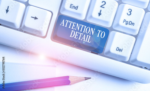 Conceptual hand writing showing Attention To Detail. Concept meaning Achieve Thoroughness and Accuracy Exactly Aware White pc keyboard with note paper above the white background