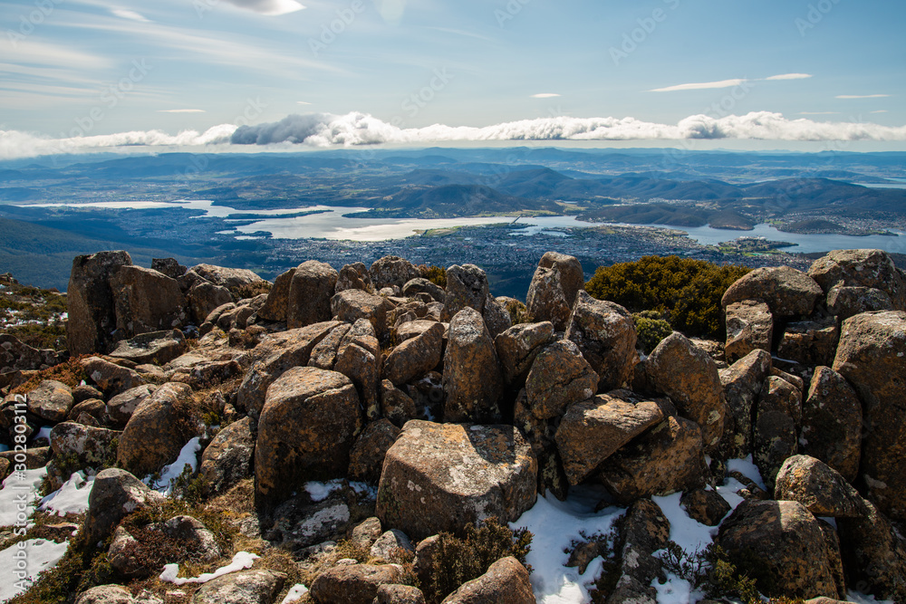 The pinnacles rock formation on the summit of Mount Wellington with the view of Hobart the capital and most populous city of the Australian island state of Tasmania