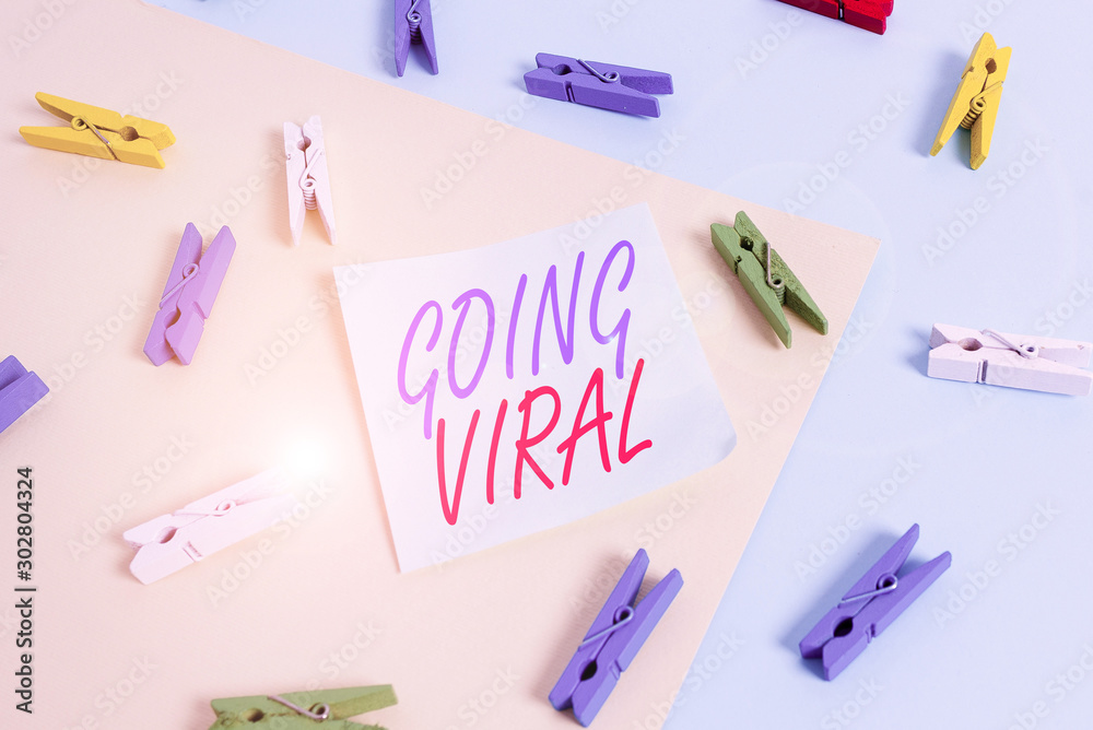 Text sign showing Going Viral. Business photo showcasing something that that spreads rapidly through a population Colored clothespin paper empty reminder yellow blue floor background office Text sign showing Going Viral. Business photo showcasing something that that spreads rapidly through a population Colored clothespin paper empty reminder yellow blue floor background office