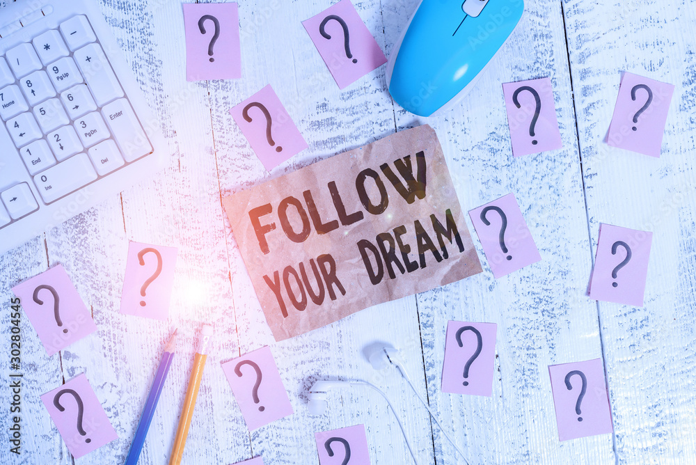 Text sign showing Follow Your Dream. Business photo showcasing Keep track on your goals Live the life you want to be Writing tools, computer stuff and scribbled paper on top of wooden table Text sign showing Follow Your Dream. Business photo showcasing Keep track on your goals Live the life you want to be Writing tools, computer stuff and scribbled paper on top of wooden table