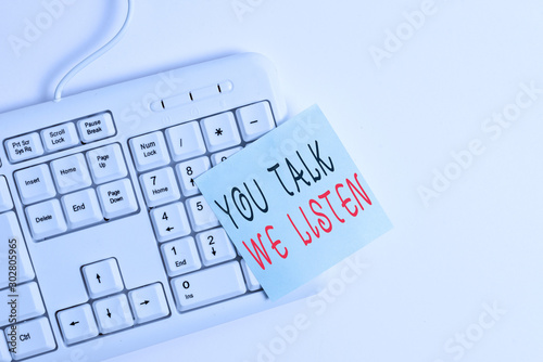 Writing note showing You Talk We Listen. Business concept for Two Way Communication Motivational Conversation White pc keyboard with empty note paper above white background