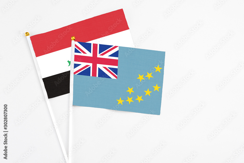 Fototapeta premium Tuvalu and Iraq stick flags on white background. High quality fabric, miniature national flag. Peaceful global concept.White floor for copy space.
