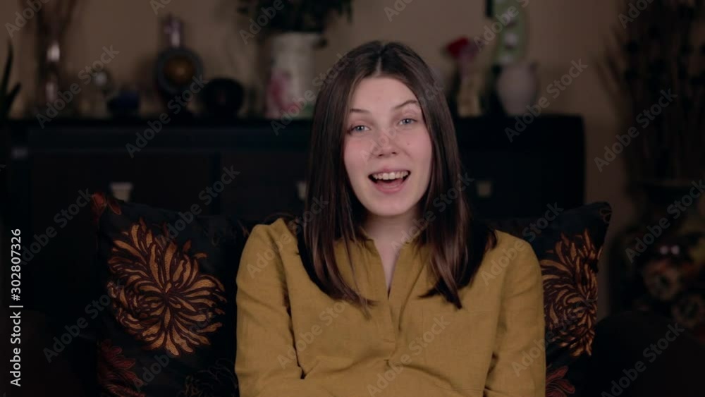 blogging or videoblog, mass media and people concept - happy smiling woman or blogger recording video and showing thumbs up at home