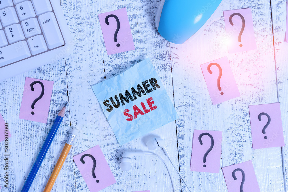 Writing note showing Summer Sale. Business concept for time when a store sells products at much lower prices than usual Writing tools and scribbled paper on top of the wooden table Writing note showing Summer Sale. Business concept for time when a store sells products at much lower prices than usual Writing tools and scribbled paper on top of the wooden table