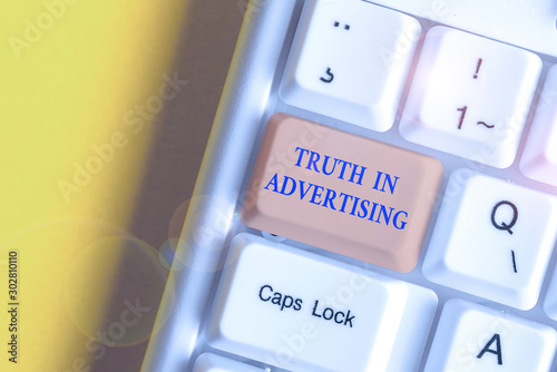 Writing note showing Truth In Advertising. Business concept for Practice Honest Advertisement Publicity Propaganda White pc keyboard with note paper above the white background photo