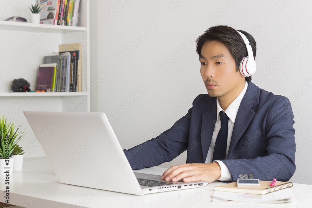 Asian Man Call Center Wear Headset Service Customer Via Internet Asian Man Call Center Wear Headset Service Customer Via Internet